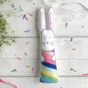 Soft bunny toy with rainbow stripes