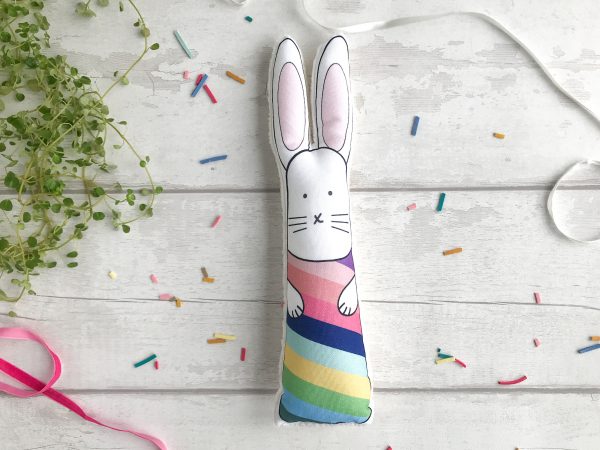 Soft bunny toy with rainbow stripes